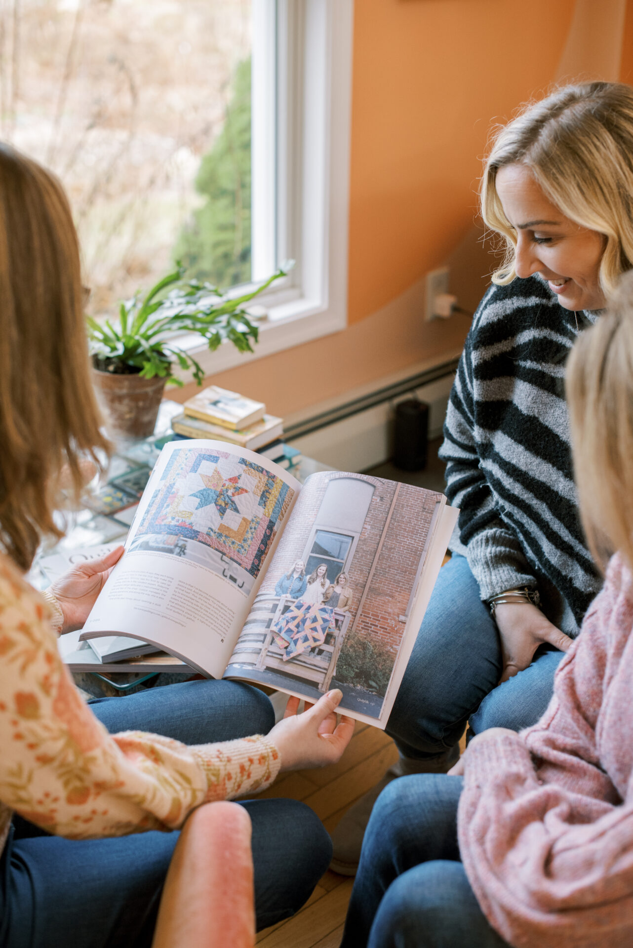Blackstone Quilting Co. sisters reading their feature in the newly released Issue 25: Rhode Island.